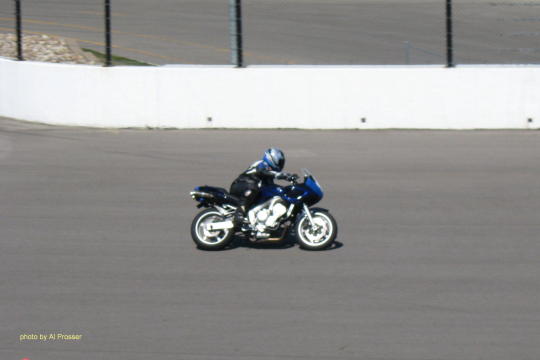 Blue bike from outside turn one